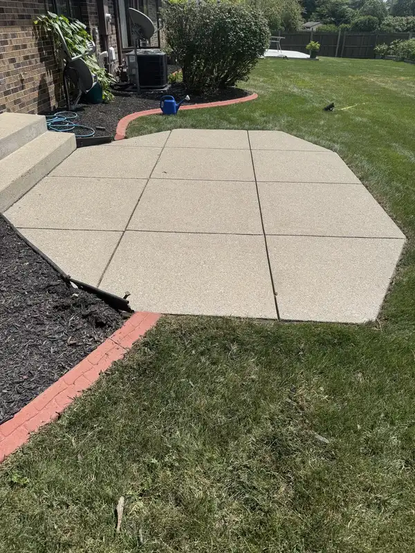 The same Columbia City patio after surface cleaning, now light tan and uniform